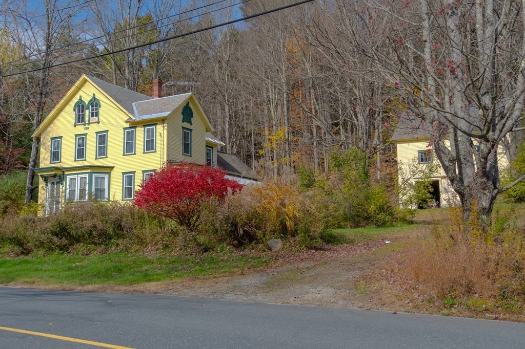 16 Hazelton Road Rowe, MA 01367 - Photo 7 of 33 a front view of a house with garden