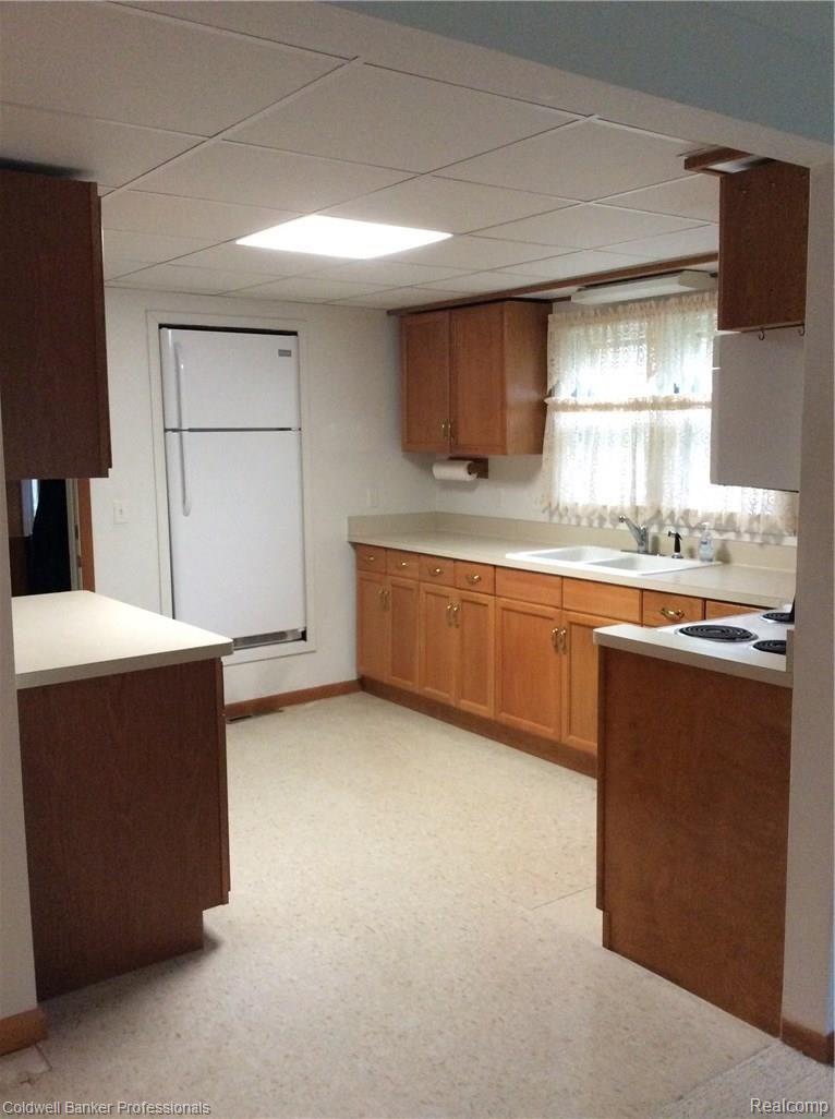 5235 Sashabaw Road Clarkston, MI 48346 - Photo 8 of 14 Sizeable kitchen with amble surface space