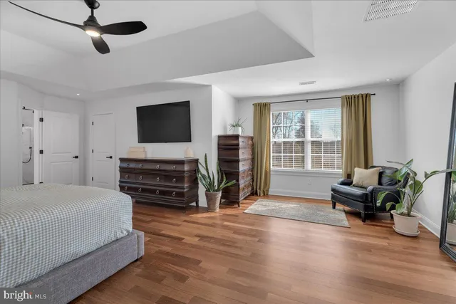 a view of a house with patio and a garden