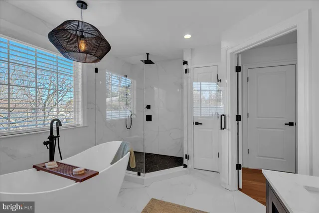 an aerial view of a house with backyard