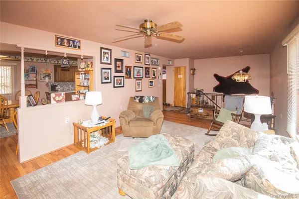 a view of a livingroom with furniture and a rug