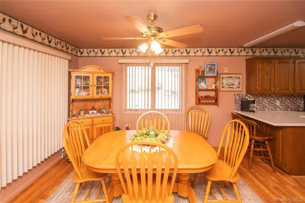 a view of a dining room with furniture and chandelier
