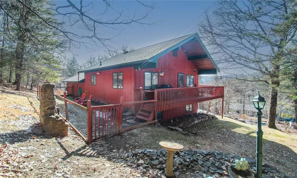 a view of a backyard with a barn and a fire pit