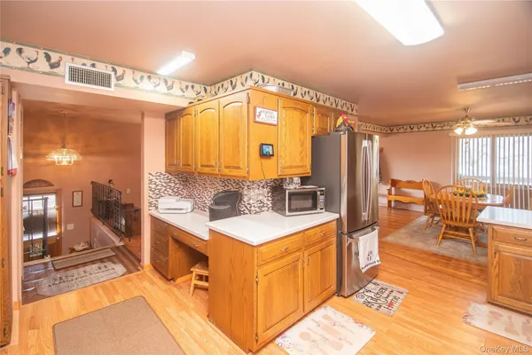 a large white kitchen with a large window