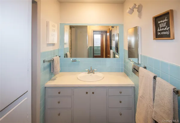 a bathroom with a sink and a mirror