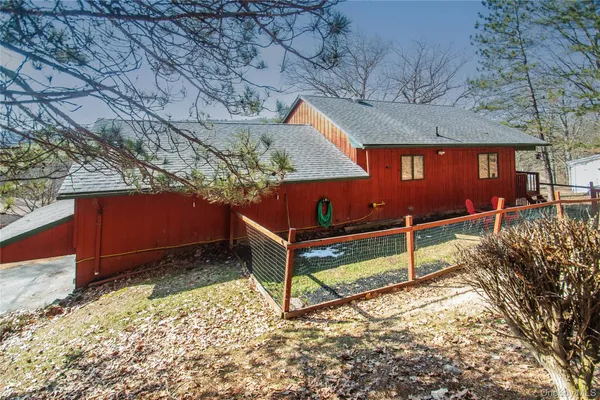 a view of an outdoor space with wooden floor