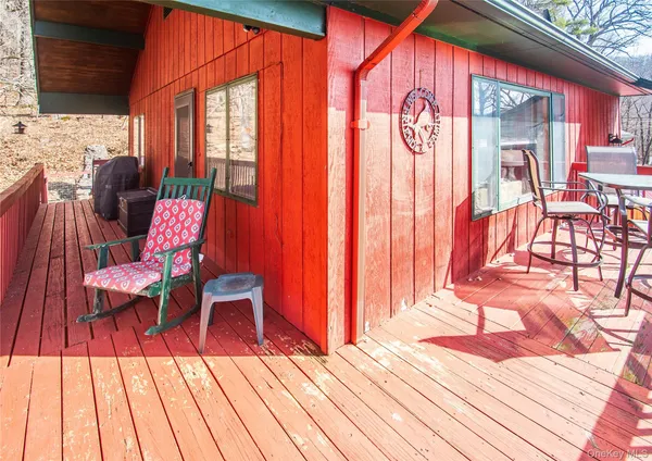 a outdoor space with a large window and furniture