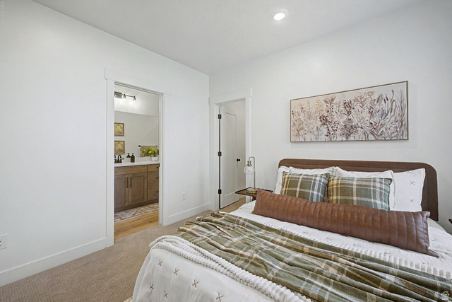 923 East Shilow Road, Unit 130 Erda, UT 84074 - Photo 35 of 43 Basement bedroom with ensuite.Images are from GTM's 2026 SL Parade Home.