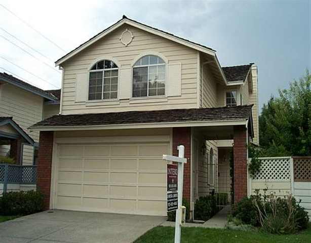 777 Winterside Circle San Ramon, CA 94583 - Photo 1 of 1 a front view of a house with a yard and garage