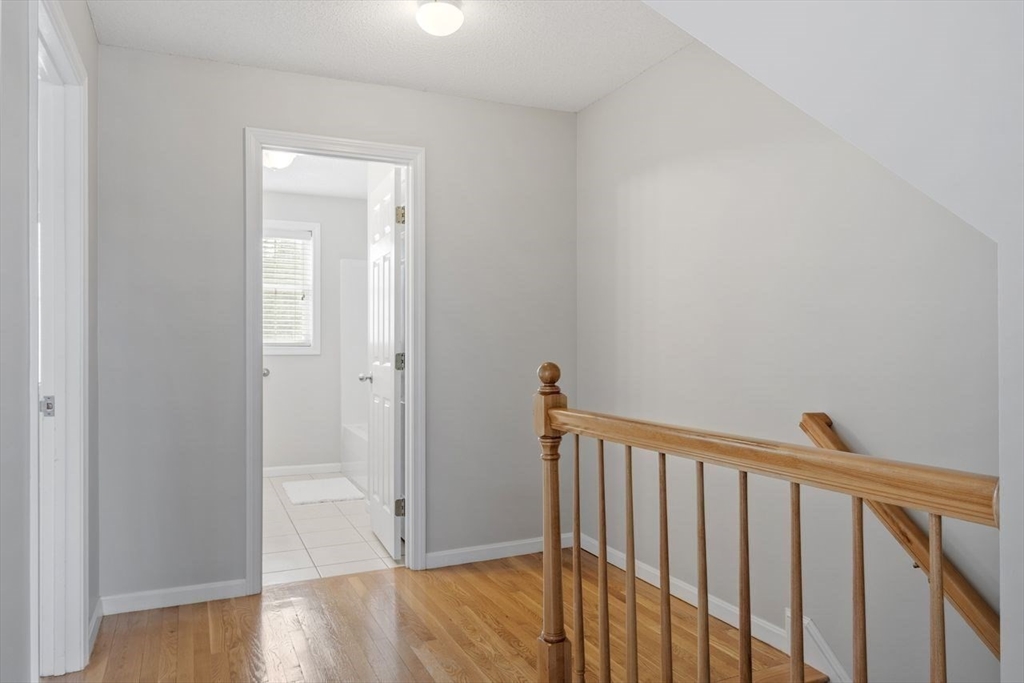 181 High Street, Unit 2 Andover, MA 01810 - Photo 16 of 32 a view of a hallway with wooden floor