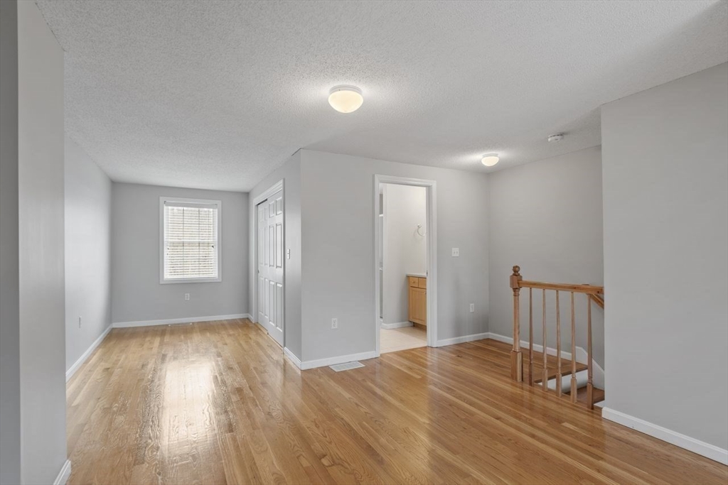 181 High Street, Unit 2 Andover, MA 01810 - Photo 18 of 32 a view of empty room with wooden floor