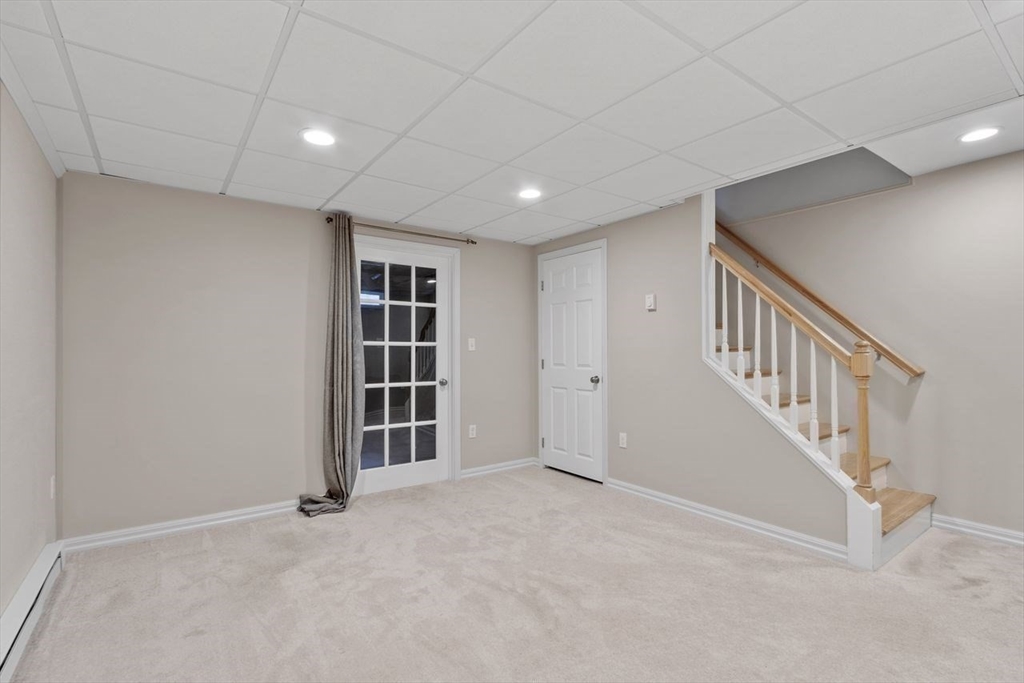 181 High Street, Unit 2 Andover, MA 01810 - Photo 21 of 32 a view of an empty room with stairs