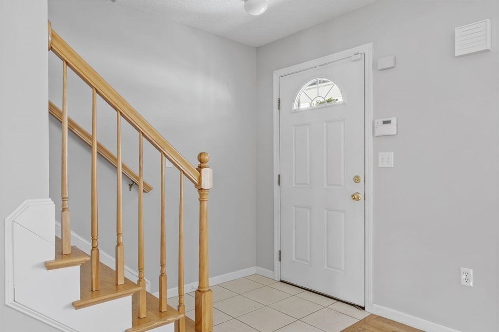 181 High Street, Unit 2 Andover, MA 01810 - Photo 9 of 32 a view of an entryway with wooden floor