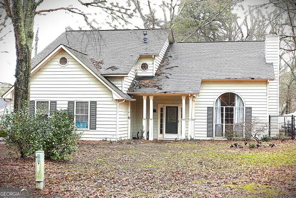 a front view of a house with garden