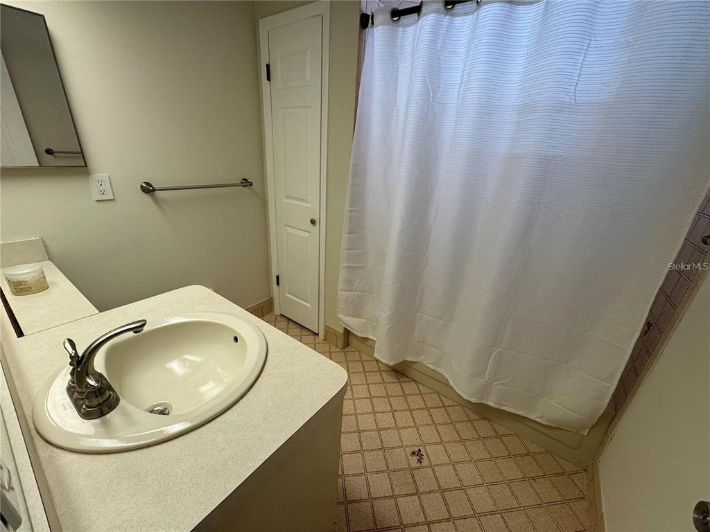 8725 Aruba Lane Port Richey, FL 34668 - Photo 13 of 31 a bathroom with a sink and a mirror