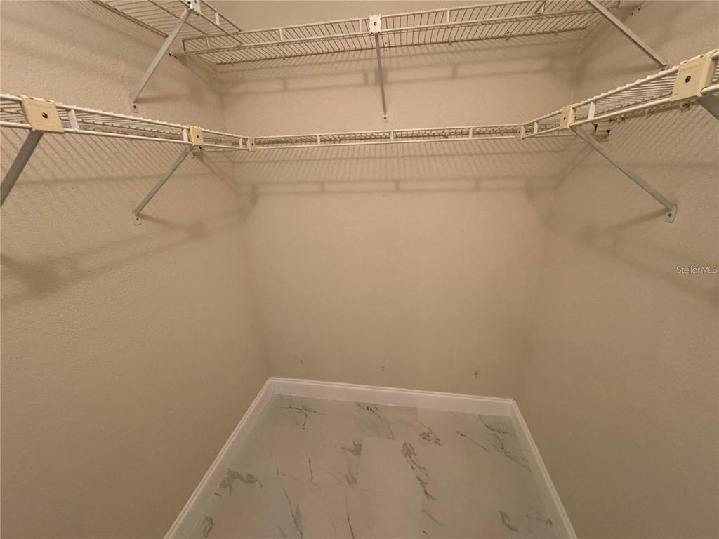 8725 Aruba Lane Port Richey, FL 34668 - Photo 16 of 31 a view of a room with racks on the wall