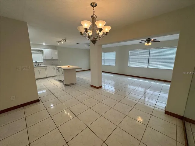 a view of a kitchen with a sink cabinets and appliances