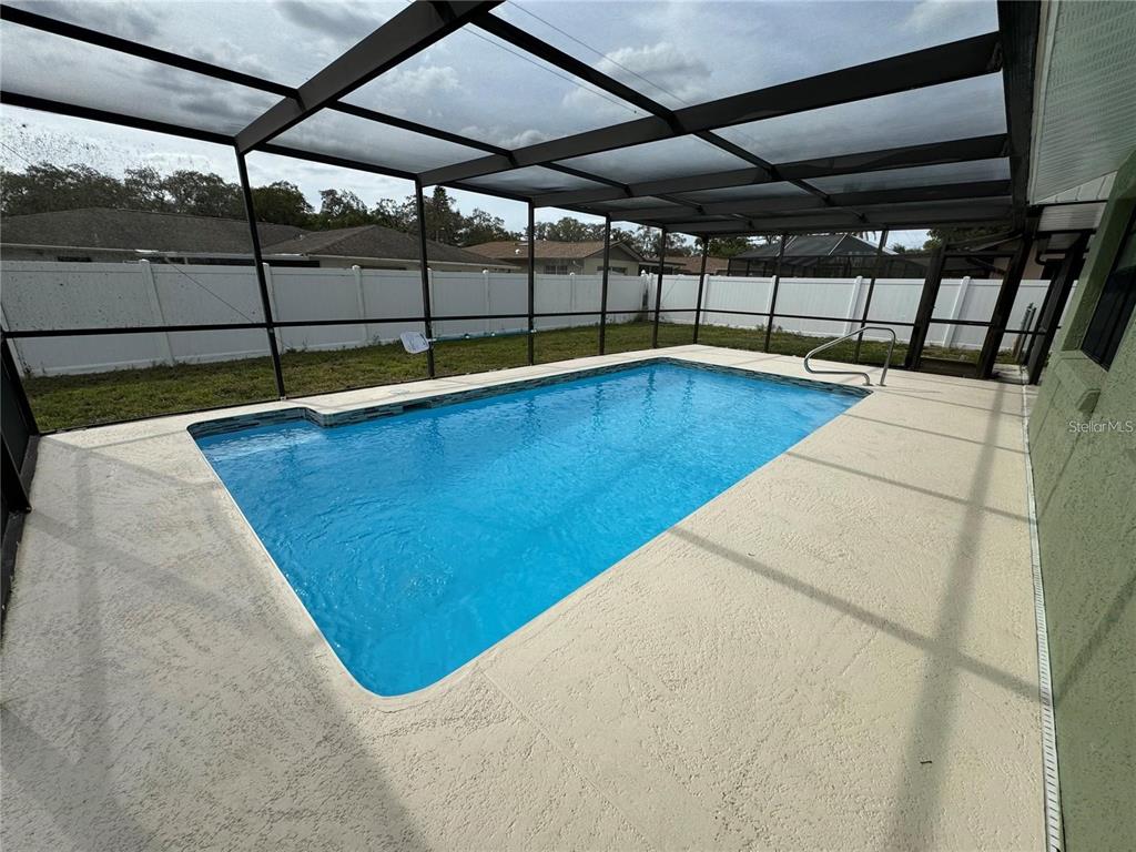 8725 Aruba Lane Port Richey, FL 34668 - Photo 8 of 31 a view of a swimming pool