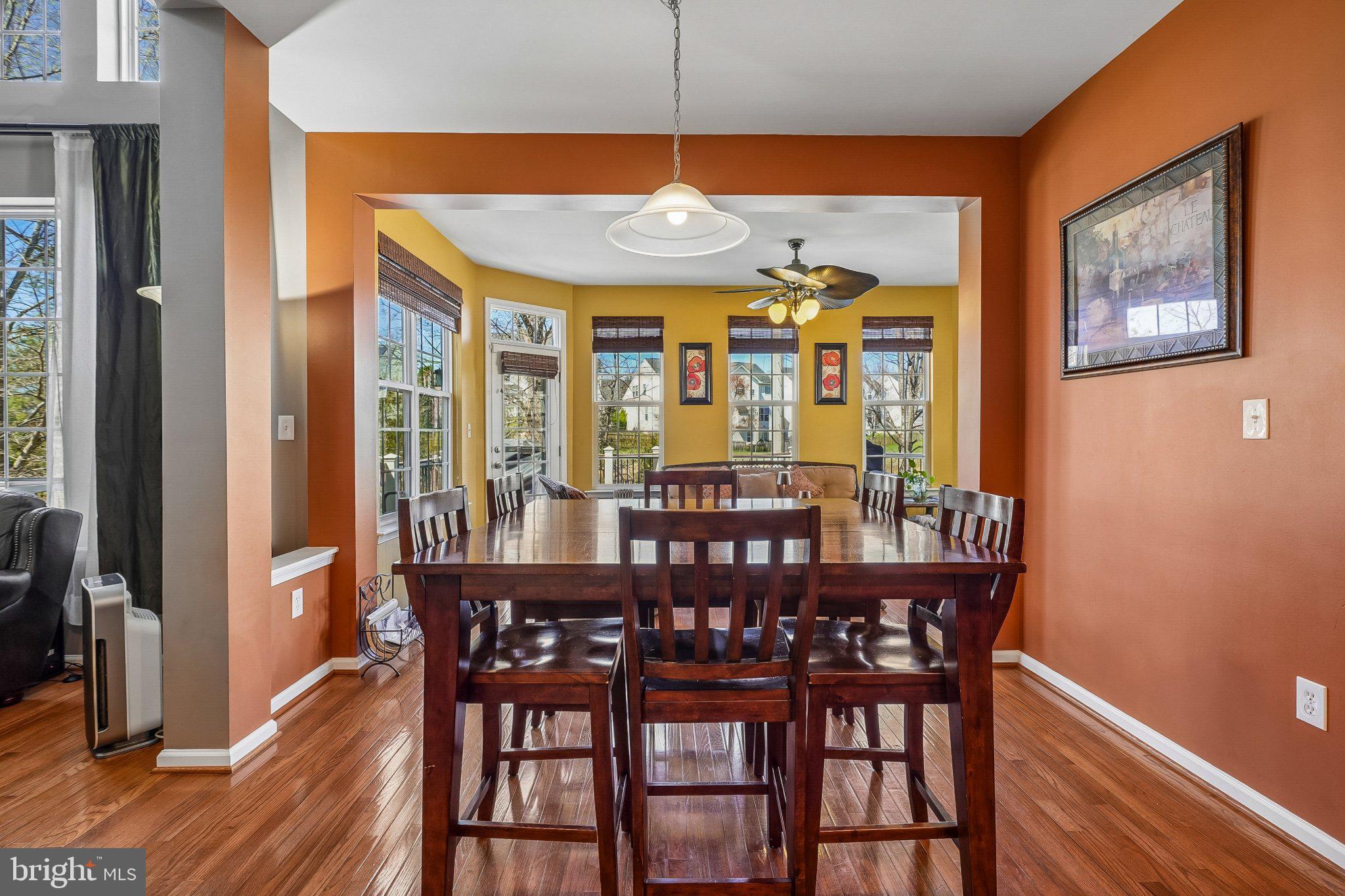 8716 Raleigh Mews Gainesville, VA 20155 - Photo 13 of 37 Bright dining space with warm hues.
