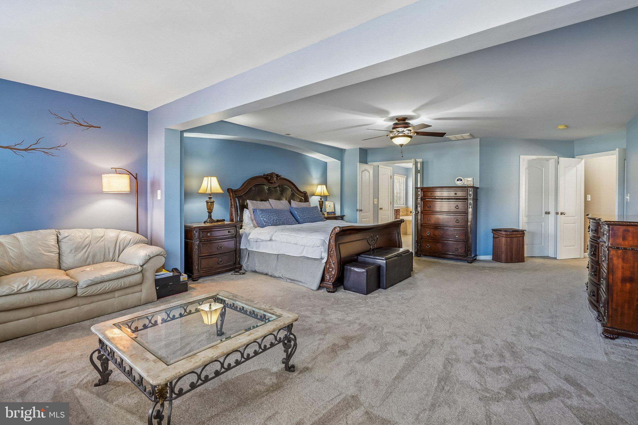 8716 Raleigh Mews Gainesville, VA 20155 - Photo 22 of 37 Spacious bedroom with serene hues.