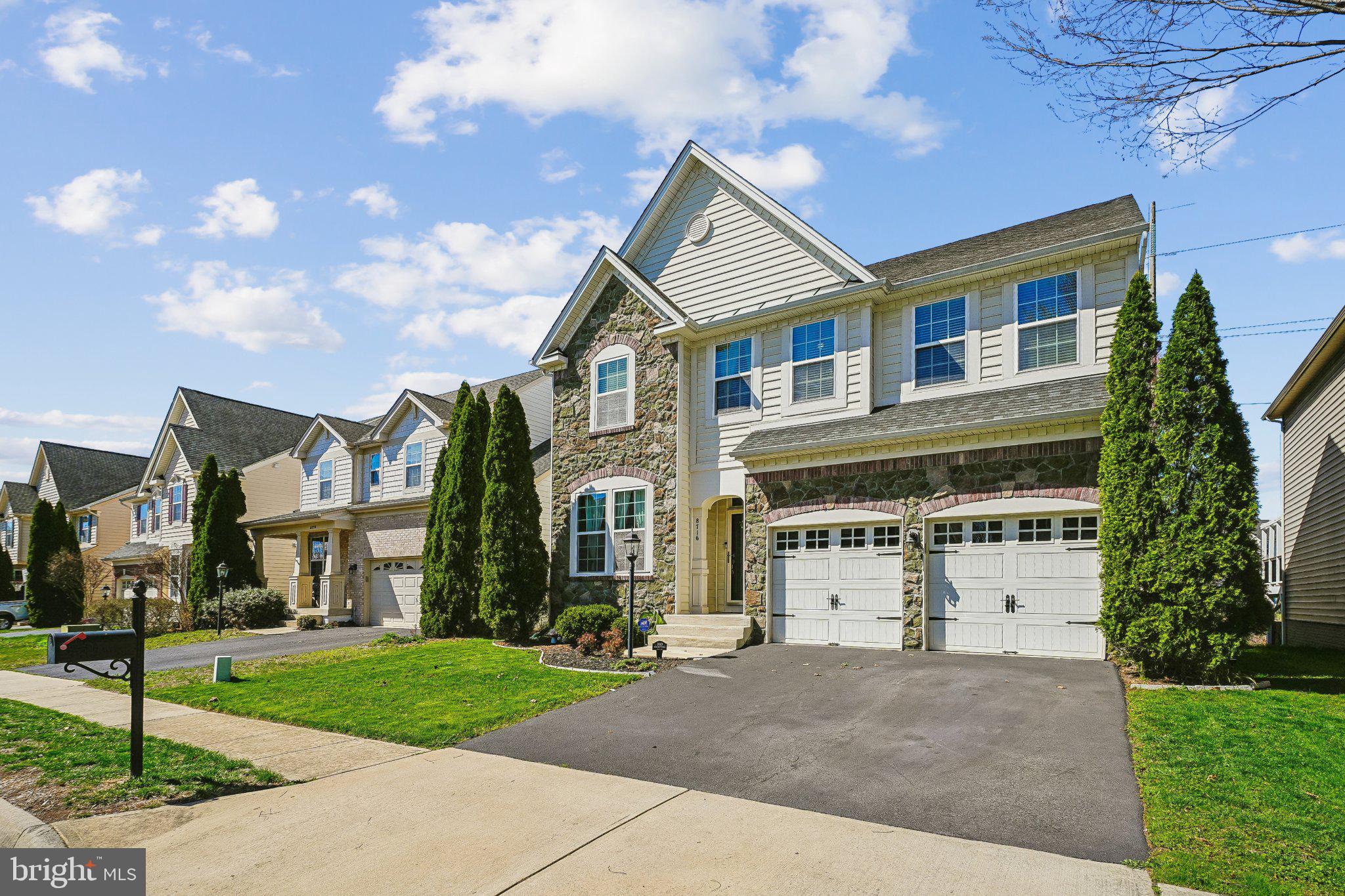8716 Raleigh Mews Gainesville, VA 20155 - Photo 3 of 37 Charming home with lush greenery.