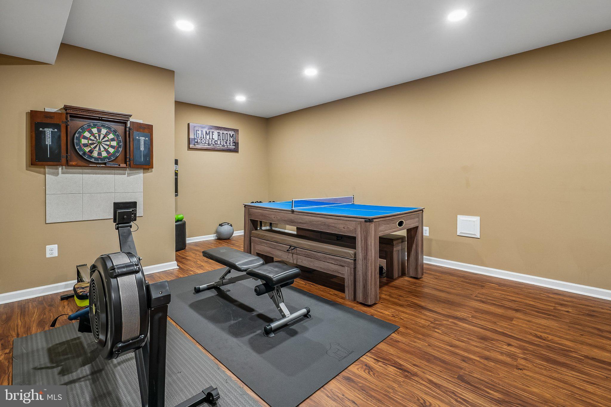 8716 Raleigh Mews Gainesville, VA 20155 - Photo 32 of 37 Versatile game room for endless fun.