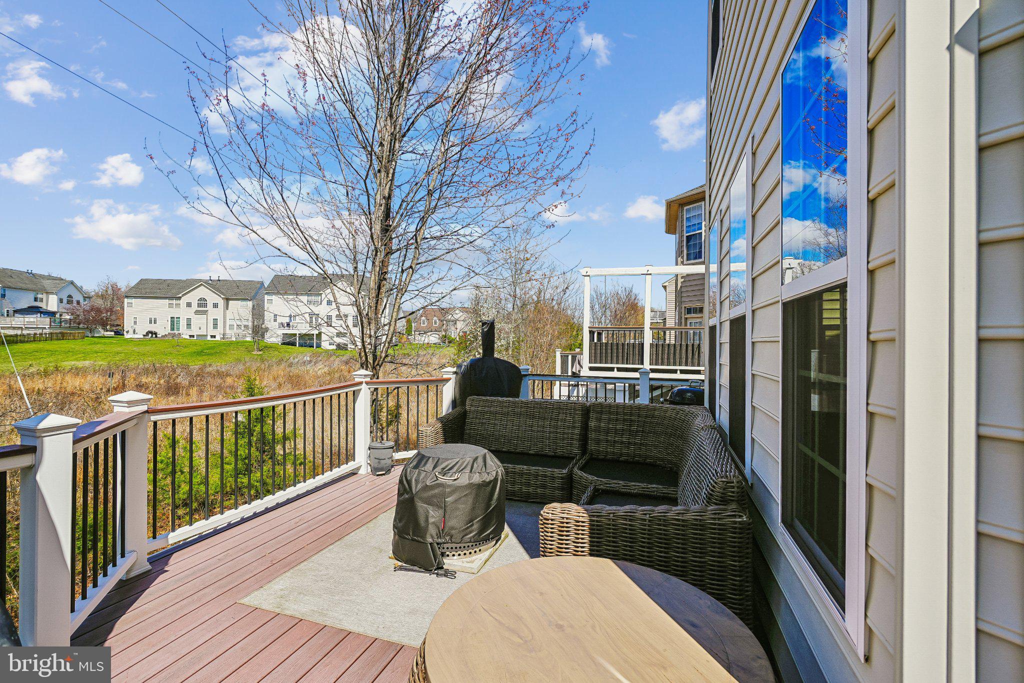 8716 Raleigh Mews Gainesville, VA 20155 - Photo 35 of 37 Serene deck with scenic views.