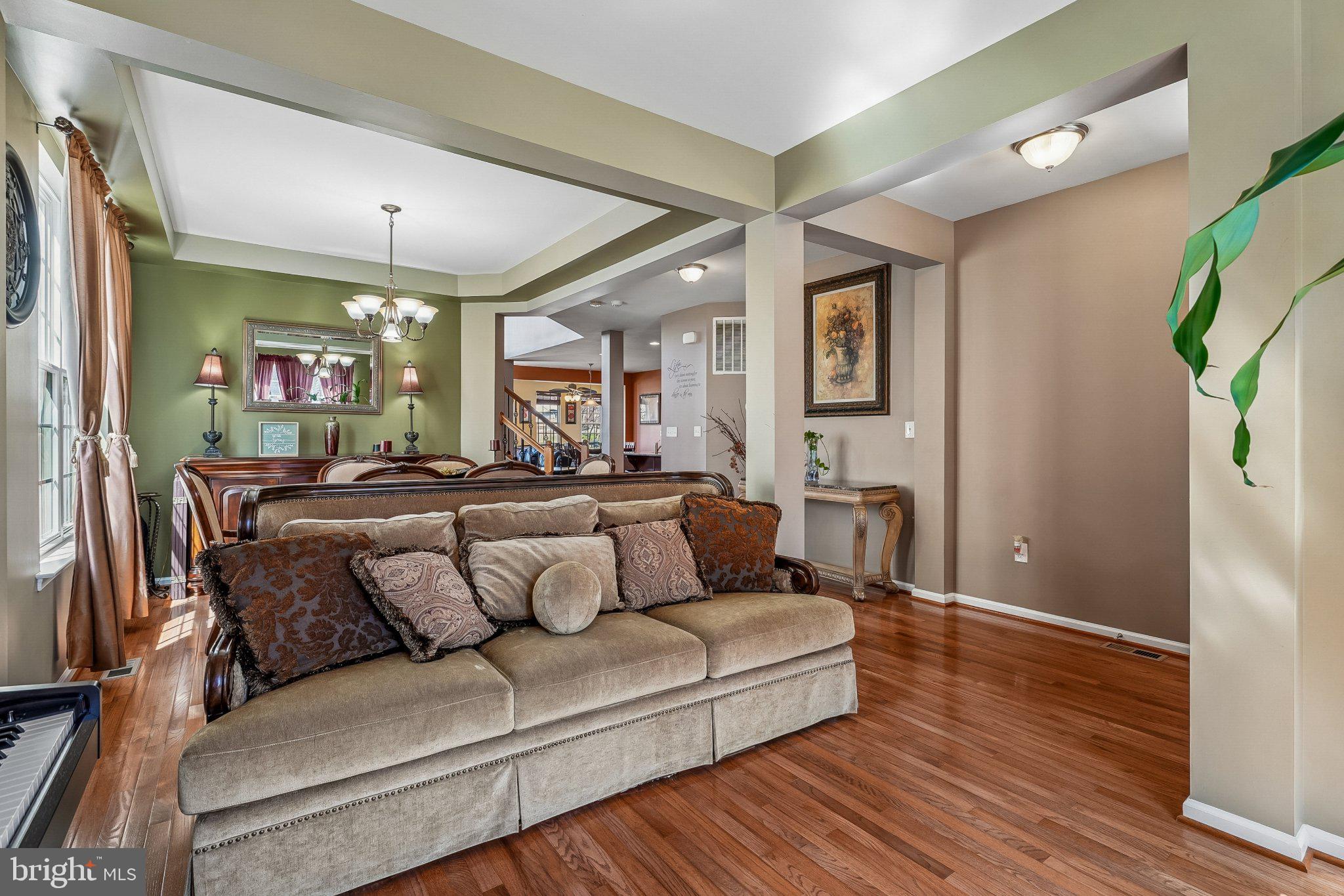 8716 Raleigh Mews Gainesville, VA 20155 - Photo 7 of 37 Inviting open space with warm tones.