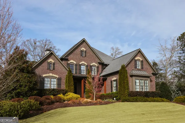 a front view of a house with a yard