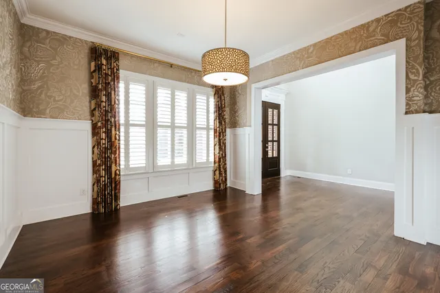 a view of a kitchen with a sink and a refrigerator