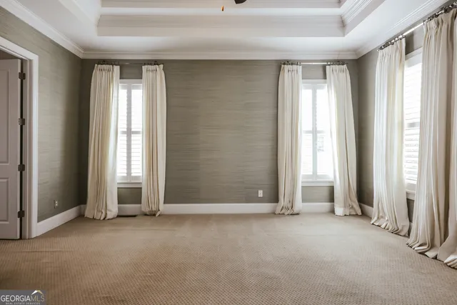 a view of a room with rack on the wall and a window