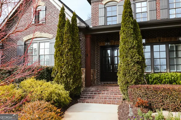 a view of a bedroom with wooden floor and closet