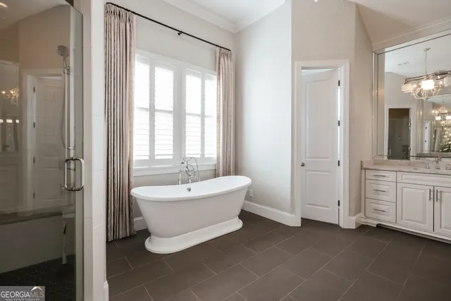 a bathroom with a granite countertop sink a toilet and shower