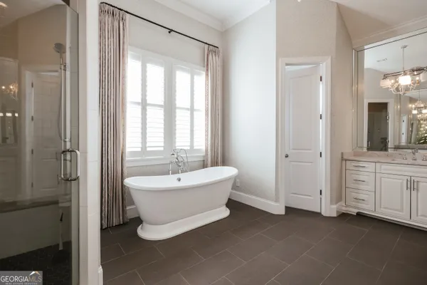 a view of a livingroom with a ceiling fan and window
