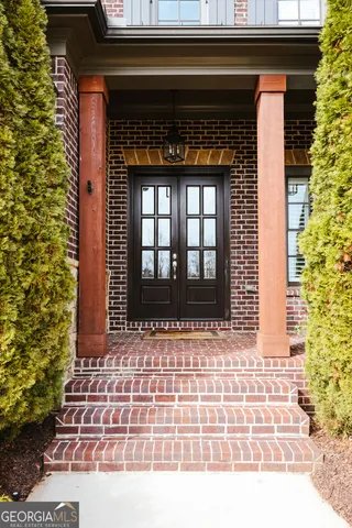 a kitchen with kitchen island wooden floors appliances and cabinets