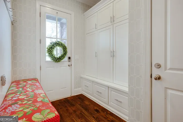 a kitchen with granite countertop a stove a sink and a refrigerator