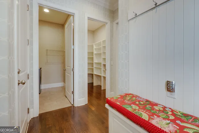 a living room with fireplace and wooden floor