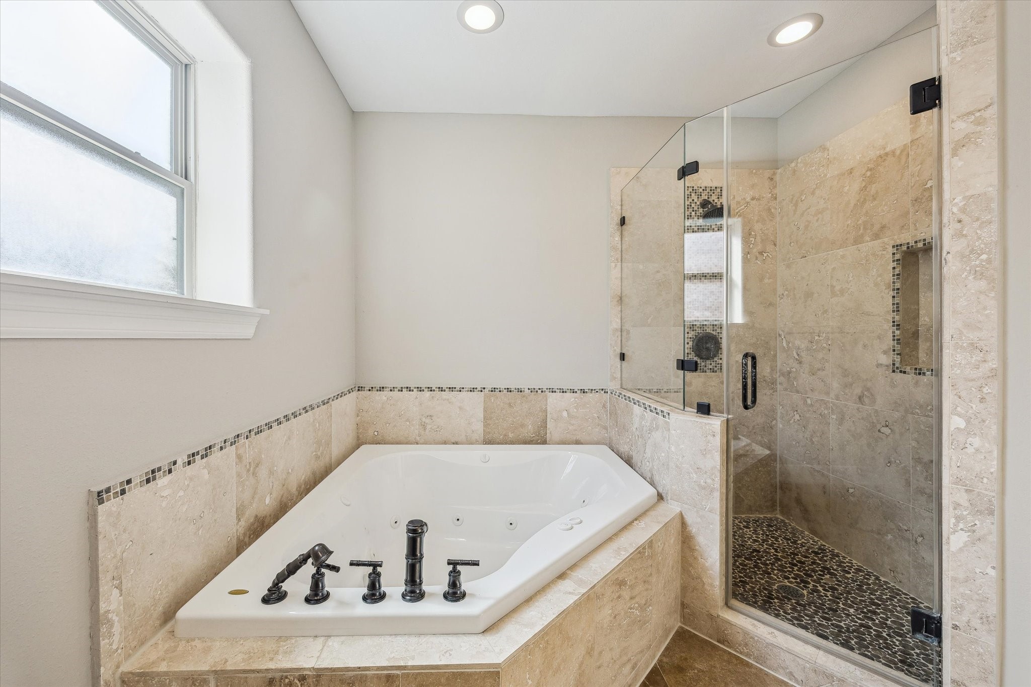 2618 Cleburne Street Houston, TX 77004 - Photo 15 of 25 a bathroom with a tub and a shower