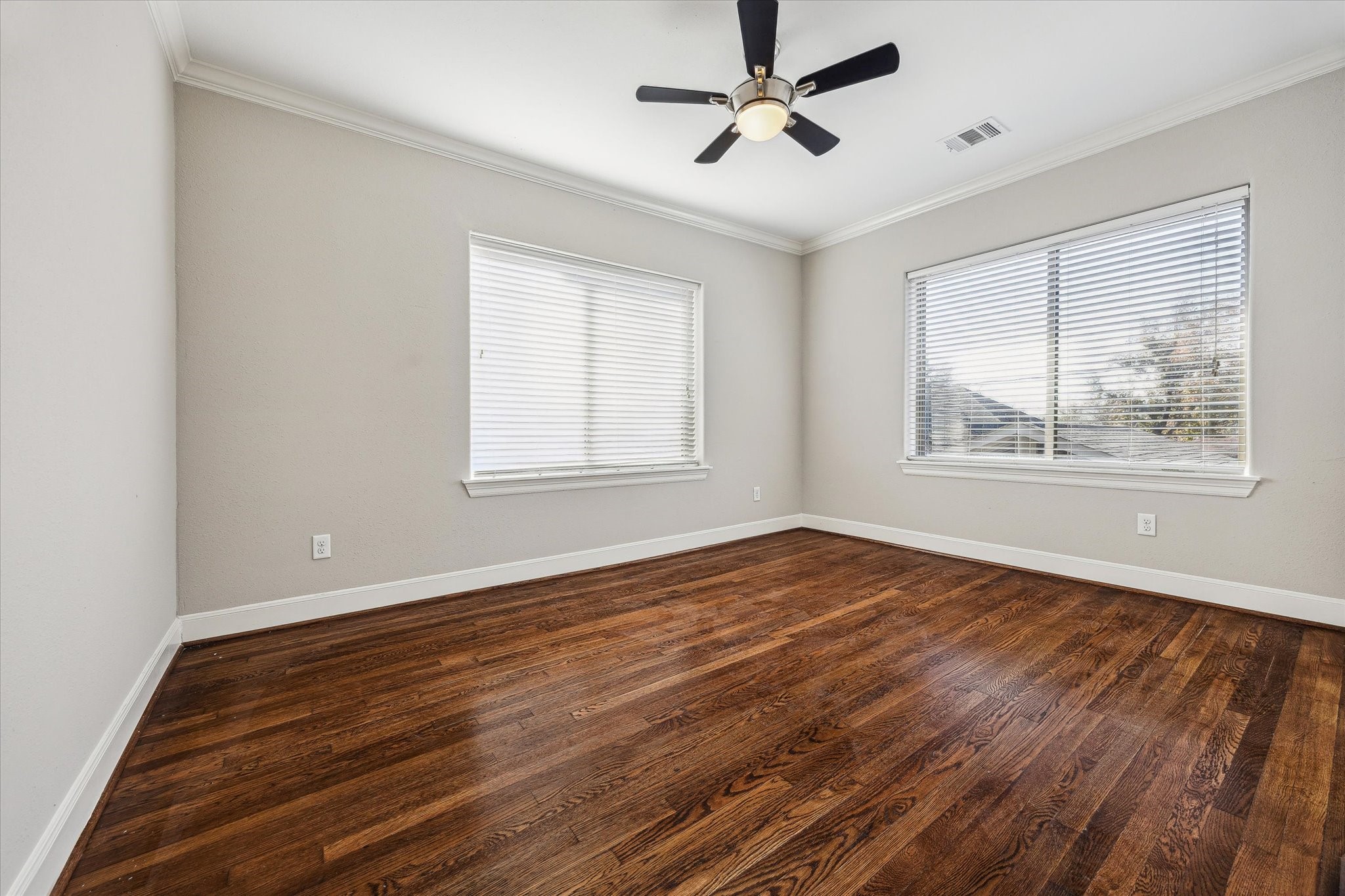 2618 Cleburne Street Houston, TX 77004 - Photo 18 of 25 a view of an empty room with wooden floor and a window