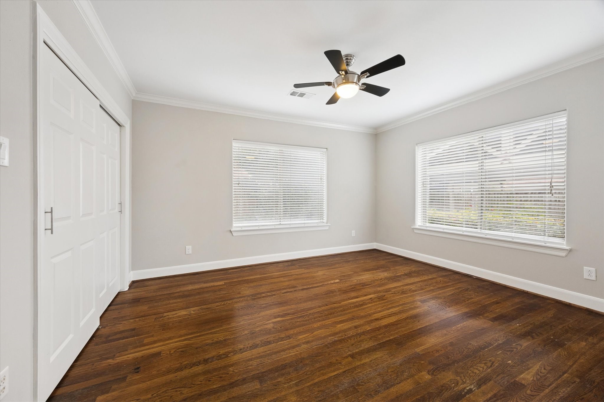 2618 Cleburne Street Houston, TX 77004 - Photo 23 of 25 a view of empty room with wooden floor and fan