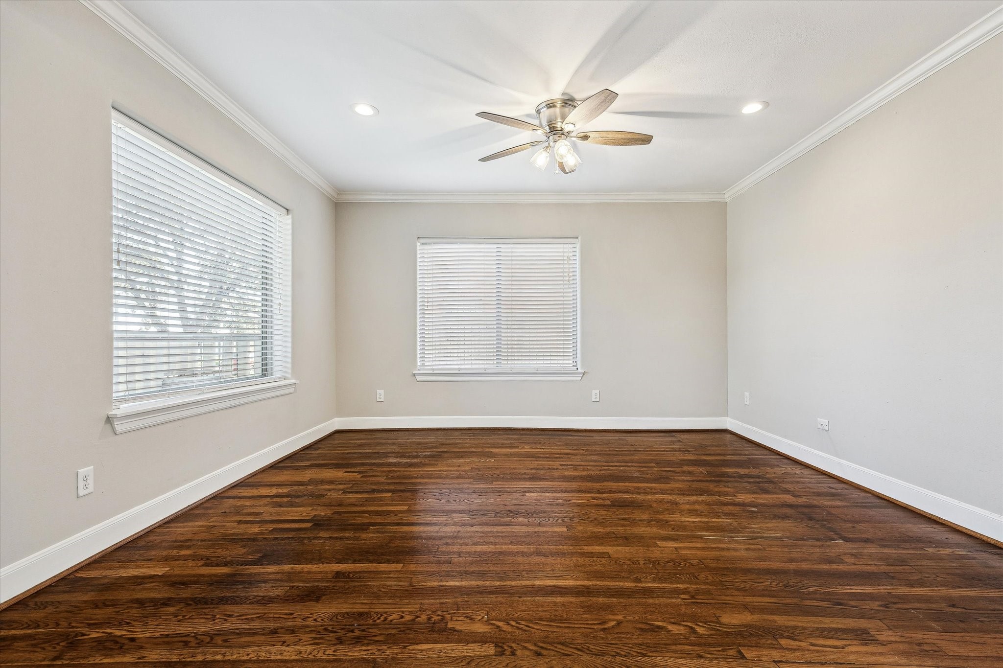 2618 Cleburne Street Houston, TX 77004 - Photo 6 of 25 a view of an empty room with wooden floor and a window