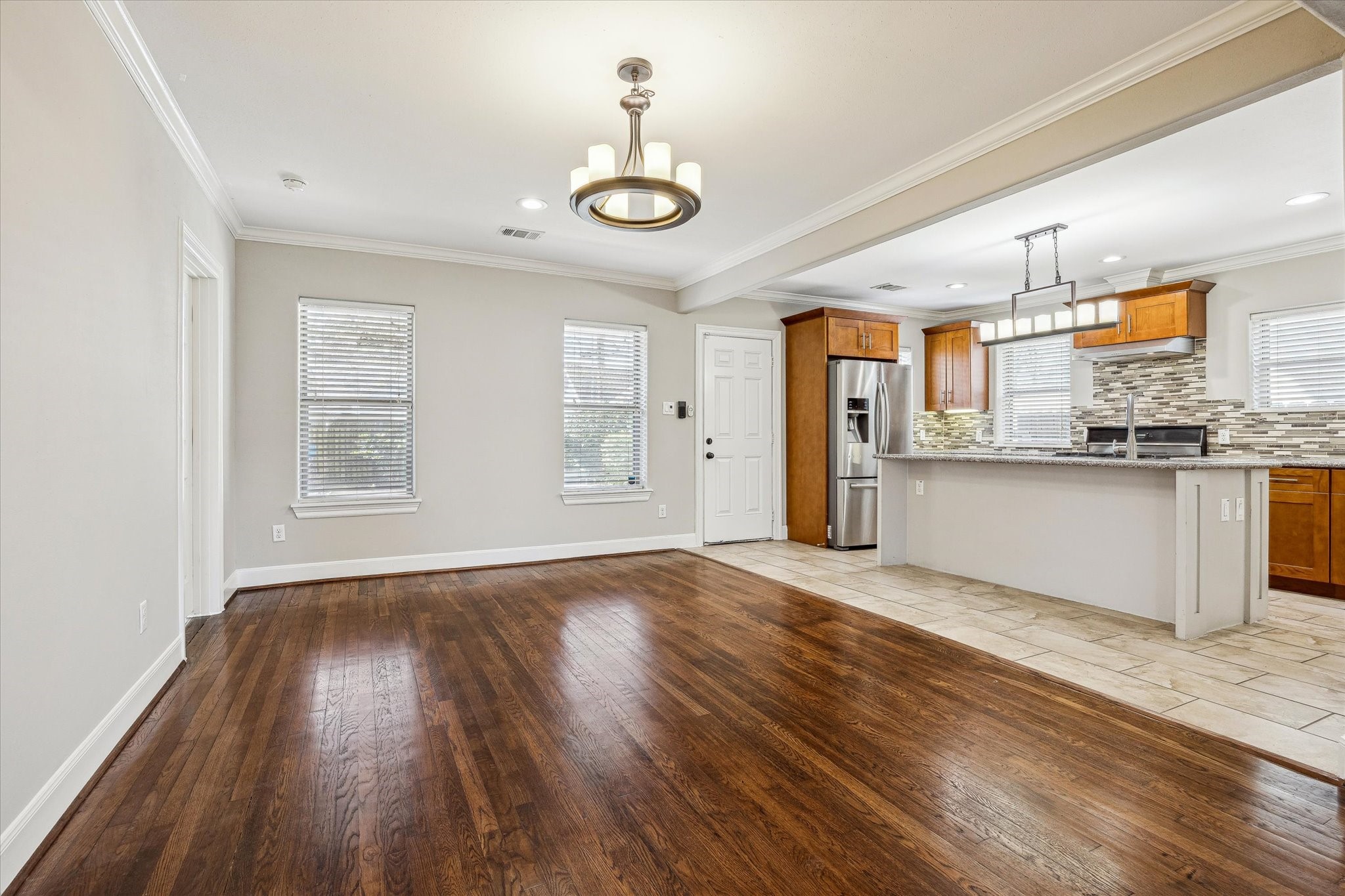 2618 Cleburne Street Houston, TX 77004 - Photo 9 of 25 a view of a kitchen with wooden floor and electronic appliances