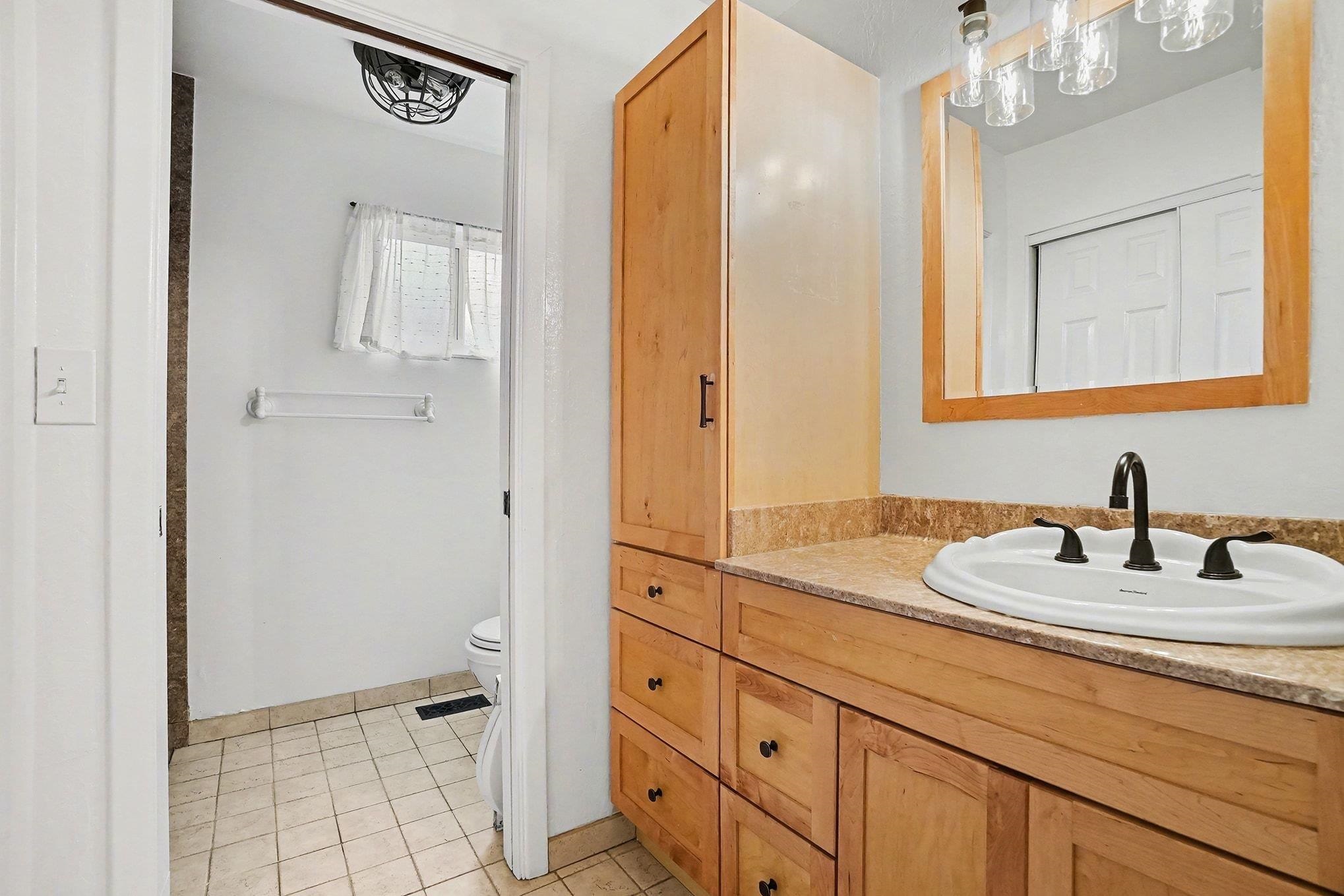 1833 Camino Estrada Concord, CA 94521 - Photo 14 of 25 a bathroom with a sink a vanity and a mirror