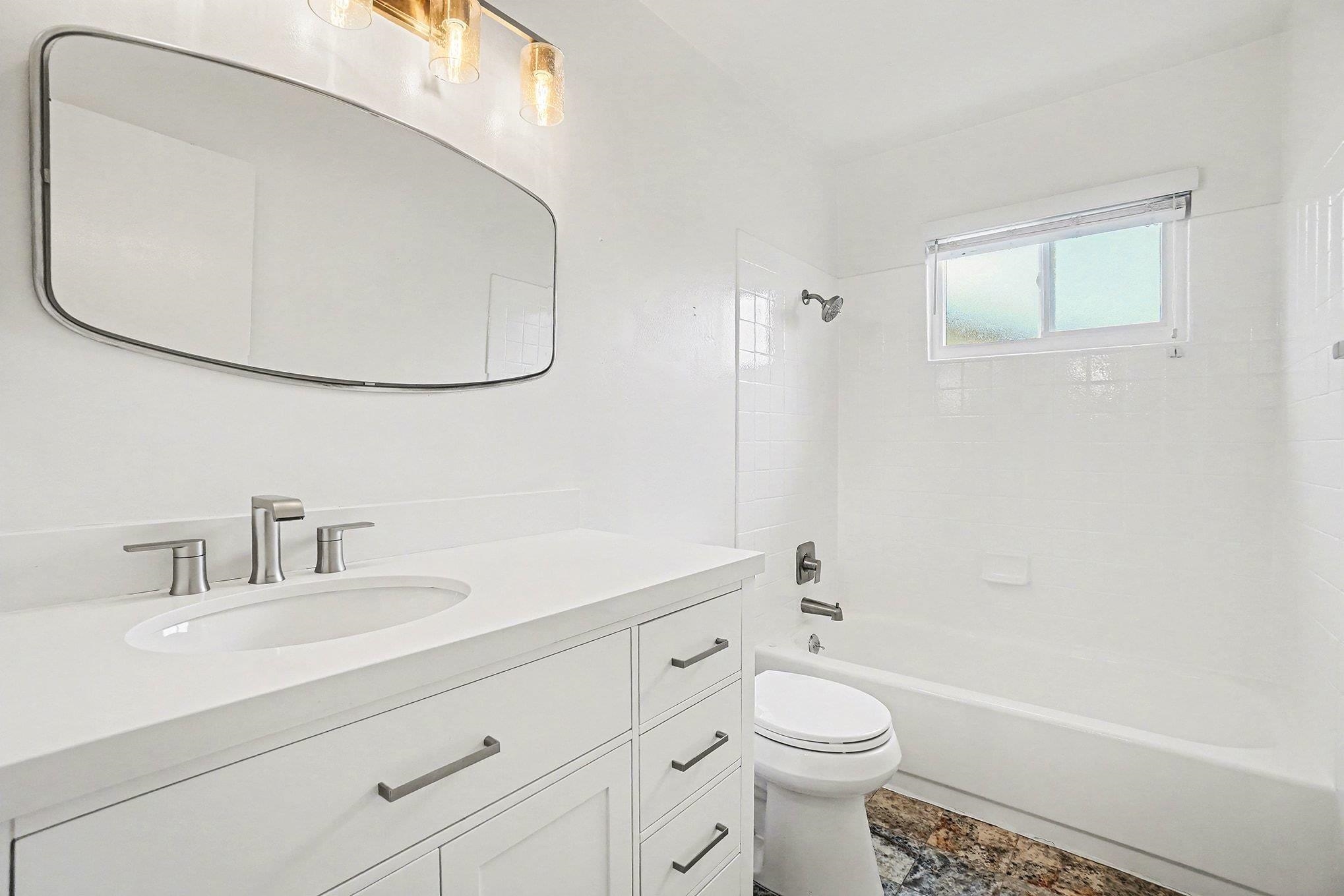 1833 Camino Estrada Concord, CA 94521 - Photo 16 of 25 a bathroom with a sink a toilet and a mirror