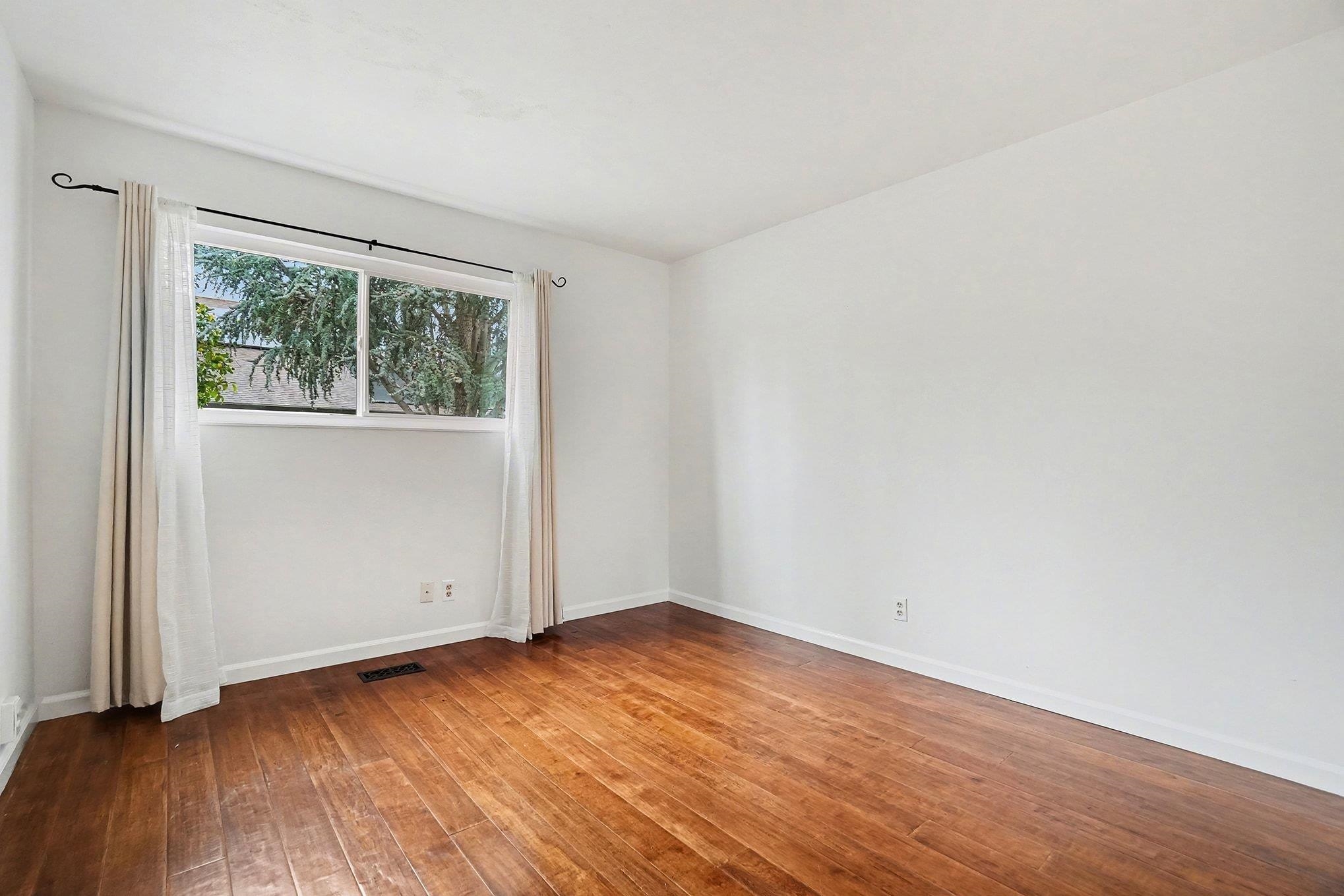 1833 Camino Estrada Concord, CA 94521 - Photo 17 of 25 an empty room with wooden floor and windows