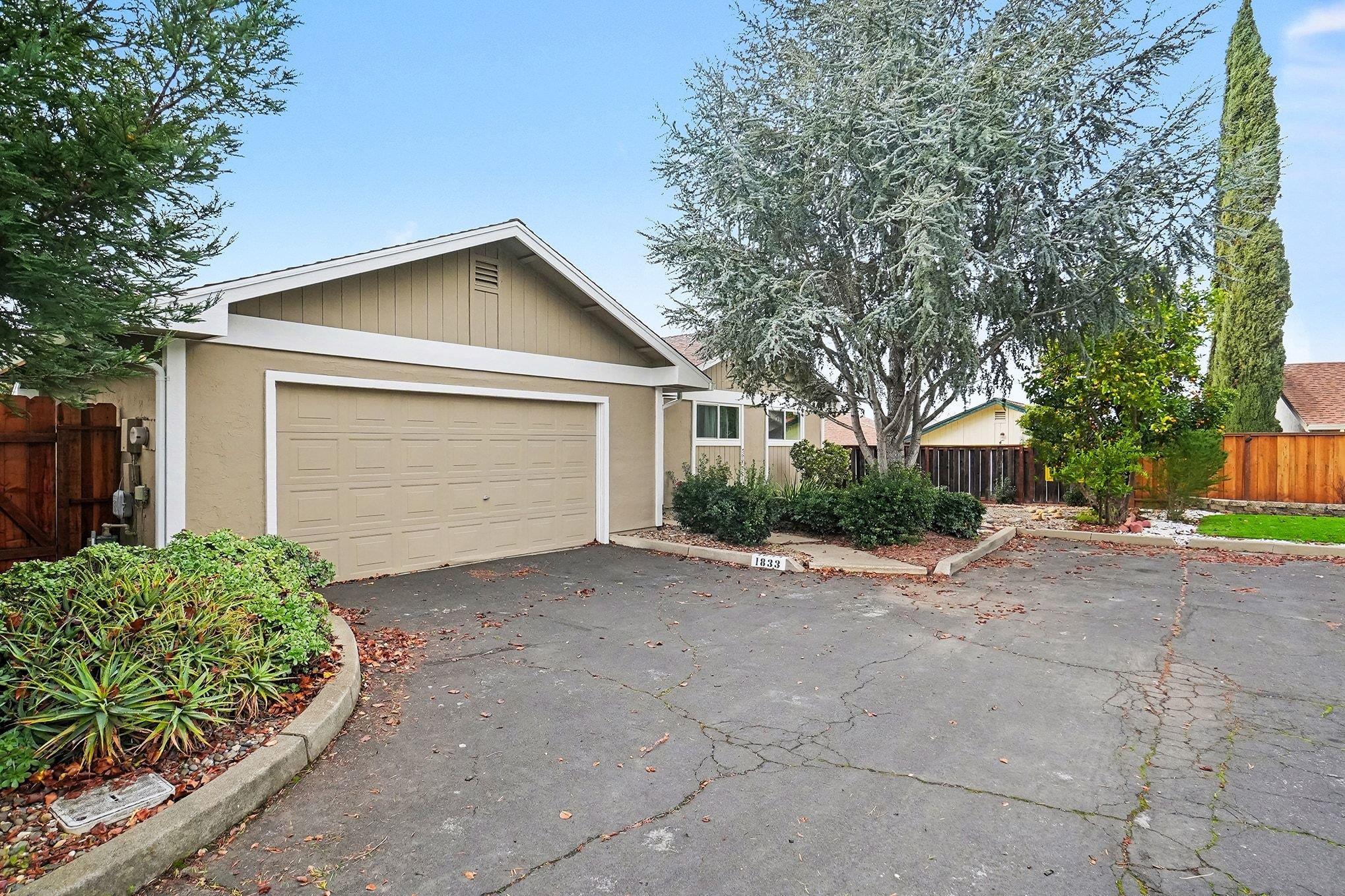 1833 Camino Estrada Concord, CA 94521 - Photo 2 of 25 a small white house with a outdoor space