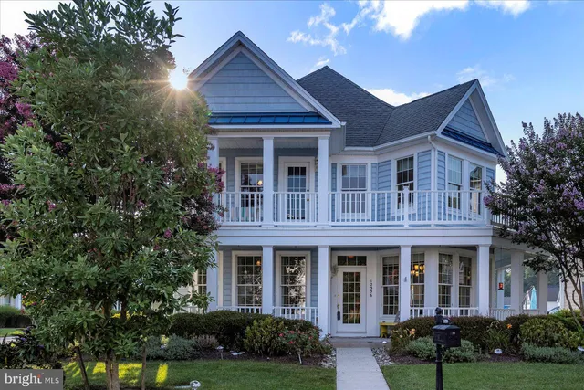 a view of a white house with a swimming pool