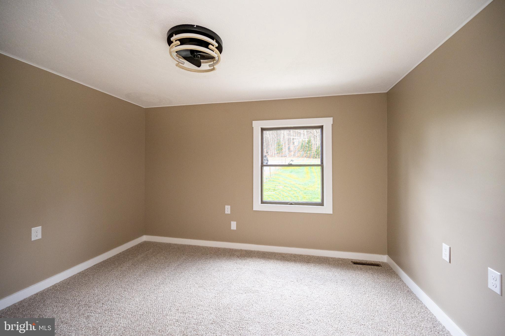 2571 Shady Dell Road Oakland, MD 21550 - Photo 13 of 60 an empty room with a window