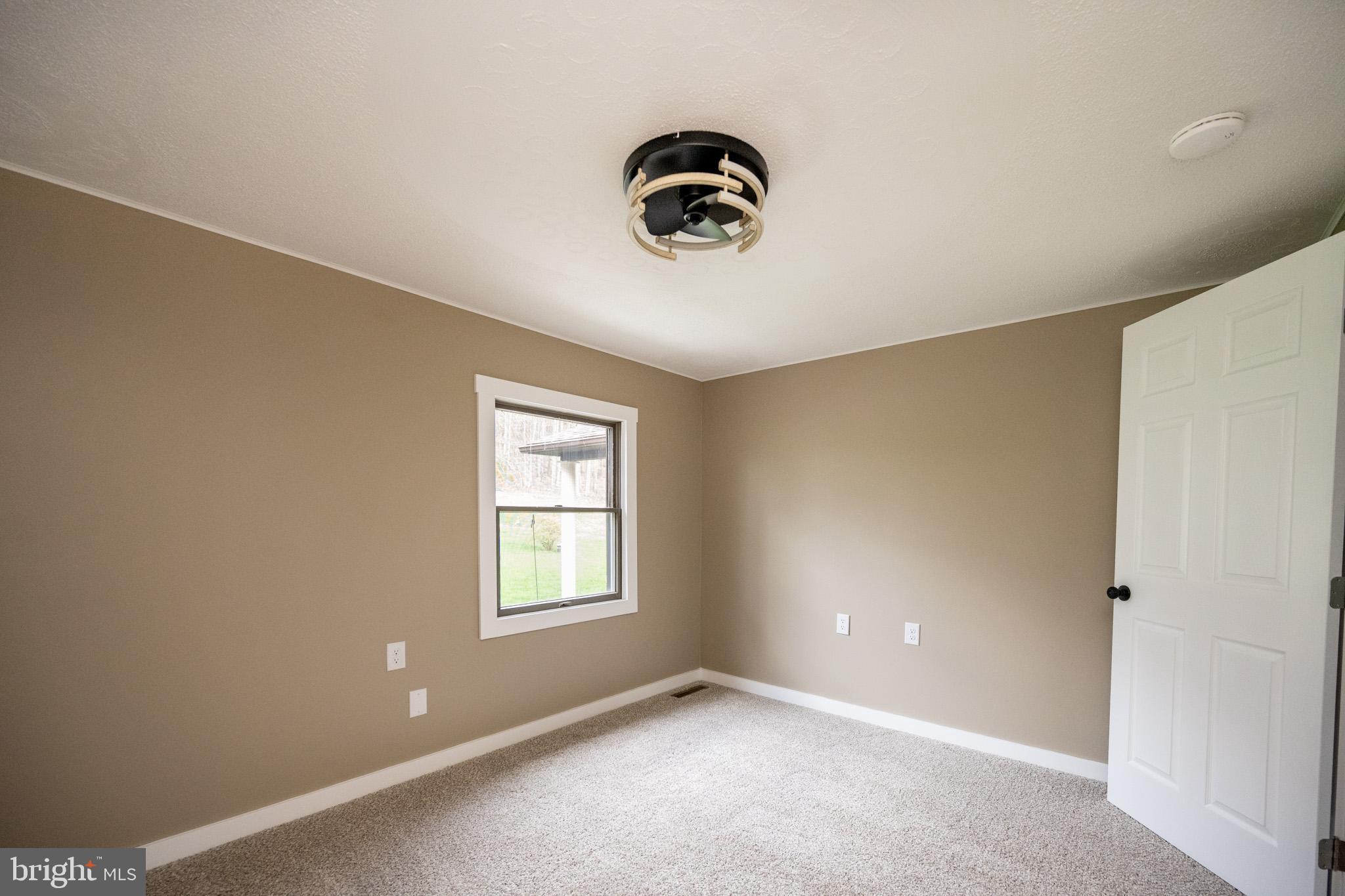 2571 Shady Dell Road Oakland, MD 21550 - Photo 14 of 60 an empty room with windows