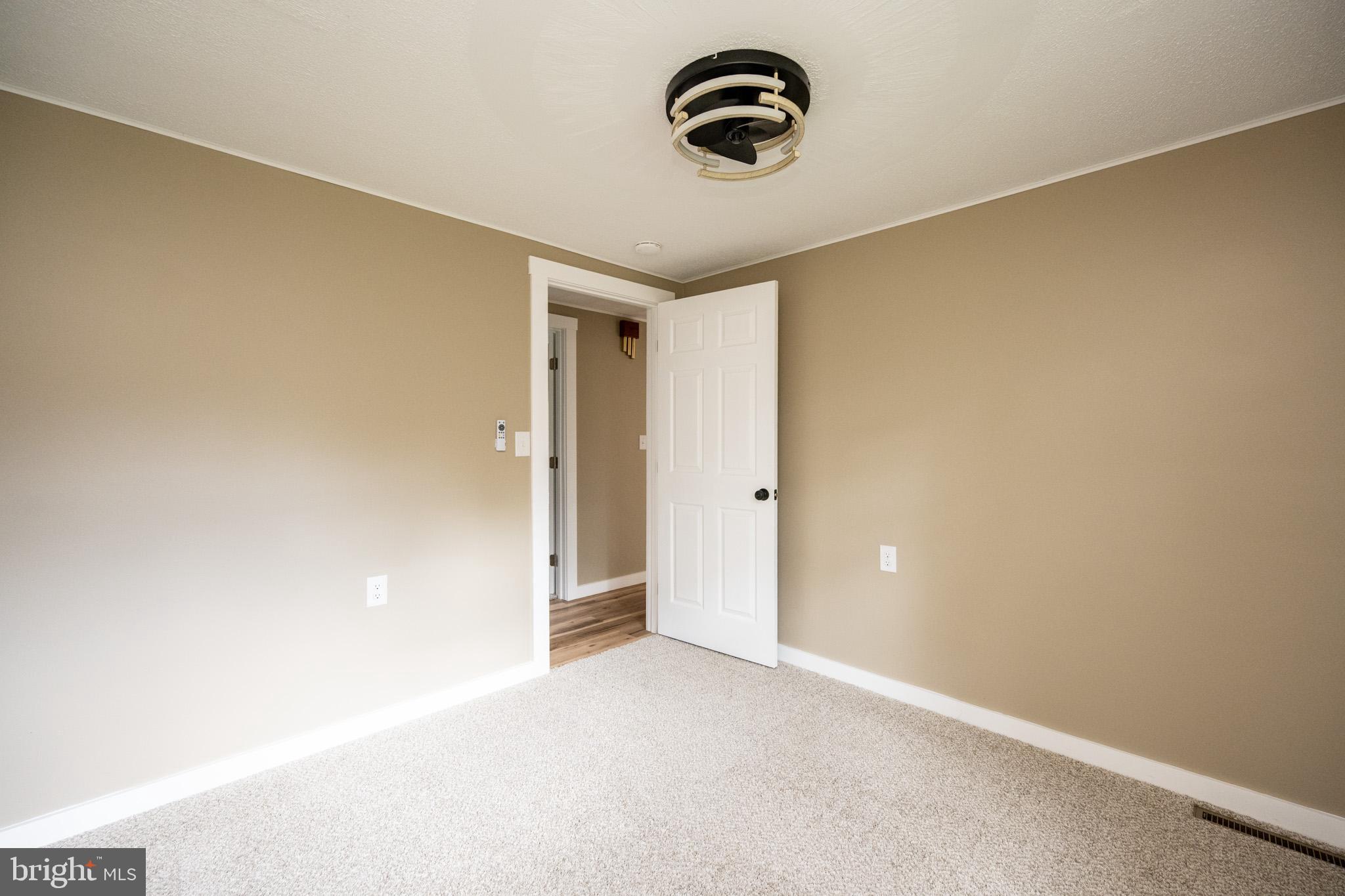 2571 Shady Dell Road Oakland, MD 21550 - Photo 16 of 60 a view of a storage & utility room with a window
